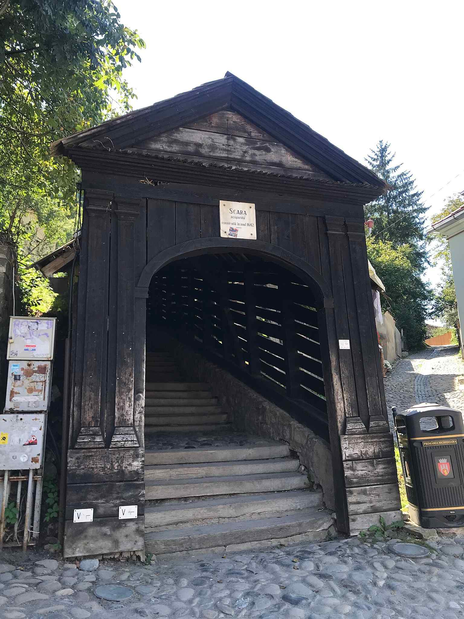 This image shows the north entrance of the Scholars' Stairs, a 'long, wooden tunnel' built in 1642 by Mayor Johann Both to ensure students had a safe climb to school during freezing winters.