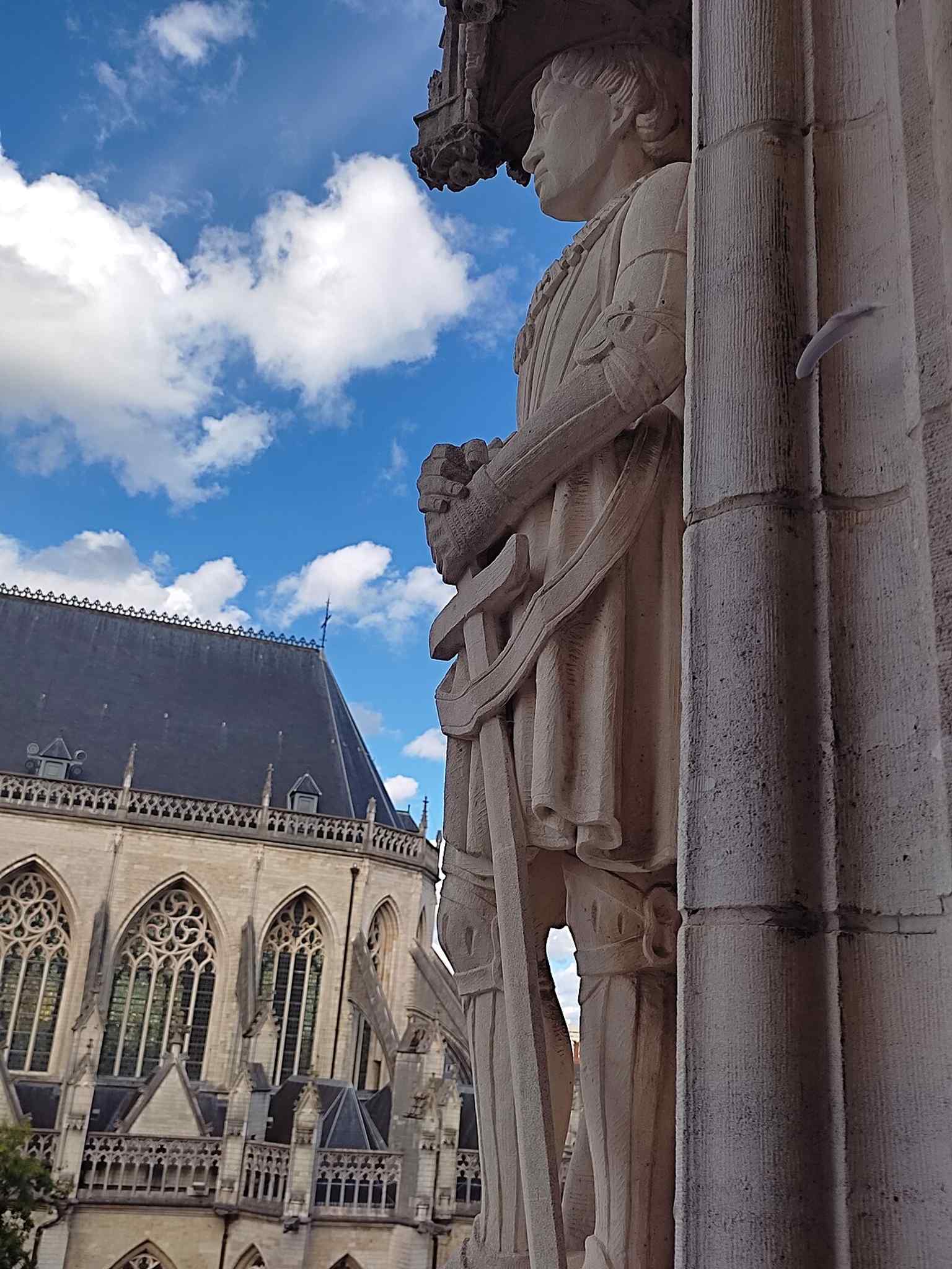 A statue of Charlemagne on the Town Hall, illustrating how Leuven’s façade mixes historical rulers and local civic symbolism.