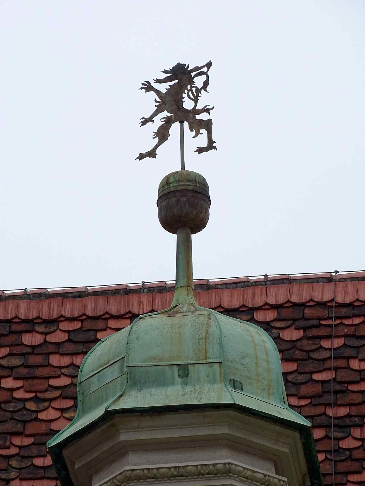The Panther on the chapel roof, a small but striking detail that reflects the Landhaus complex’s layered Renaissance and later additions.