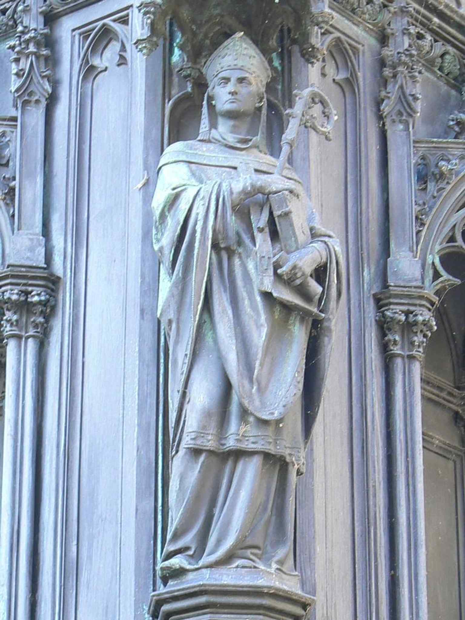 Arnošt of Pardubice, the first Archbishop of Prague, is depicted as one of Charles IV's closest advisors at the corners of the statue's base.