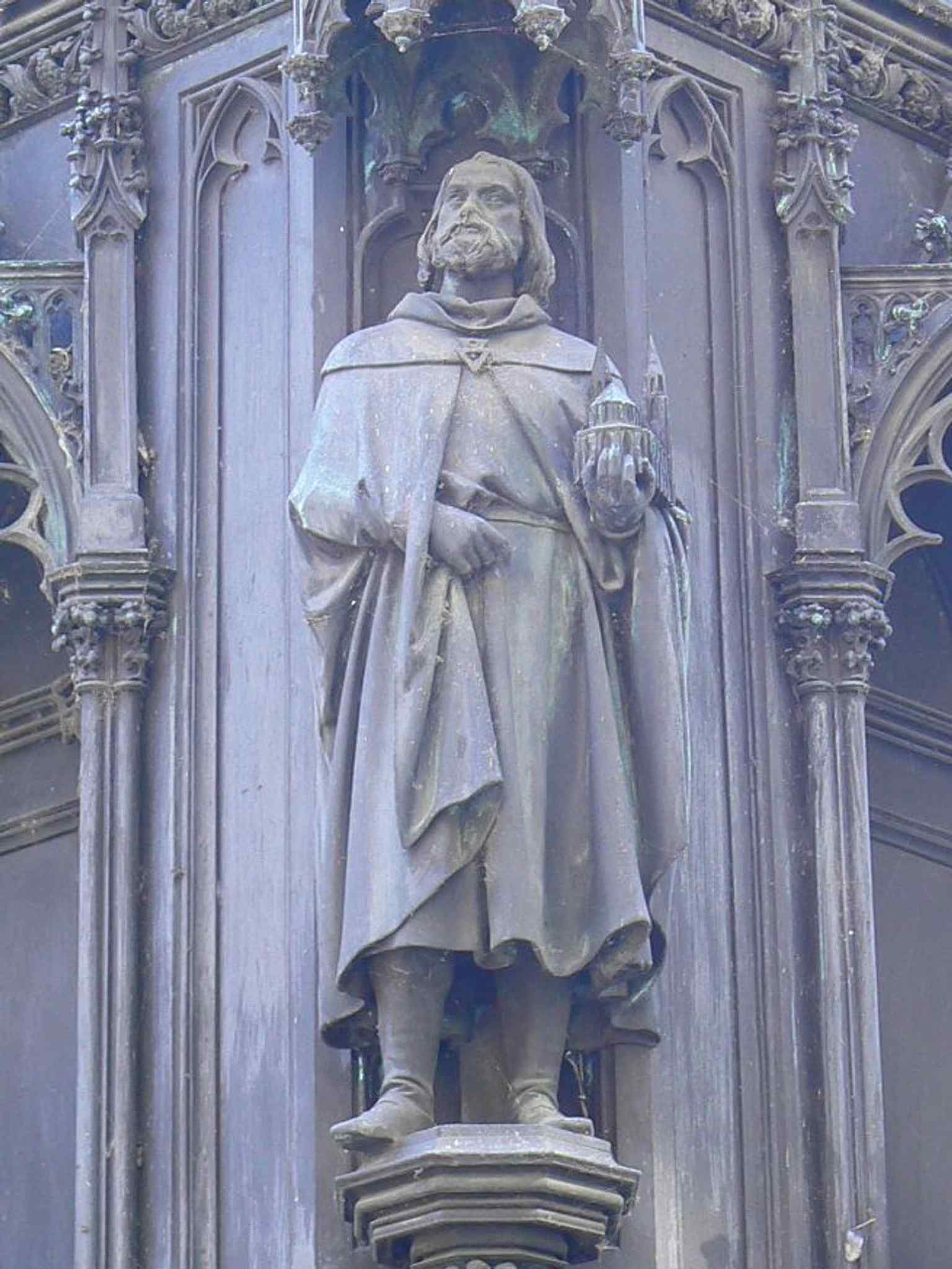 This statue, traditionally identified as architect Matthias of Arras, is debated by historians, who sometimes suggest it might be his successor, Peter Parler.