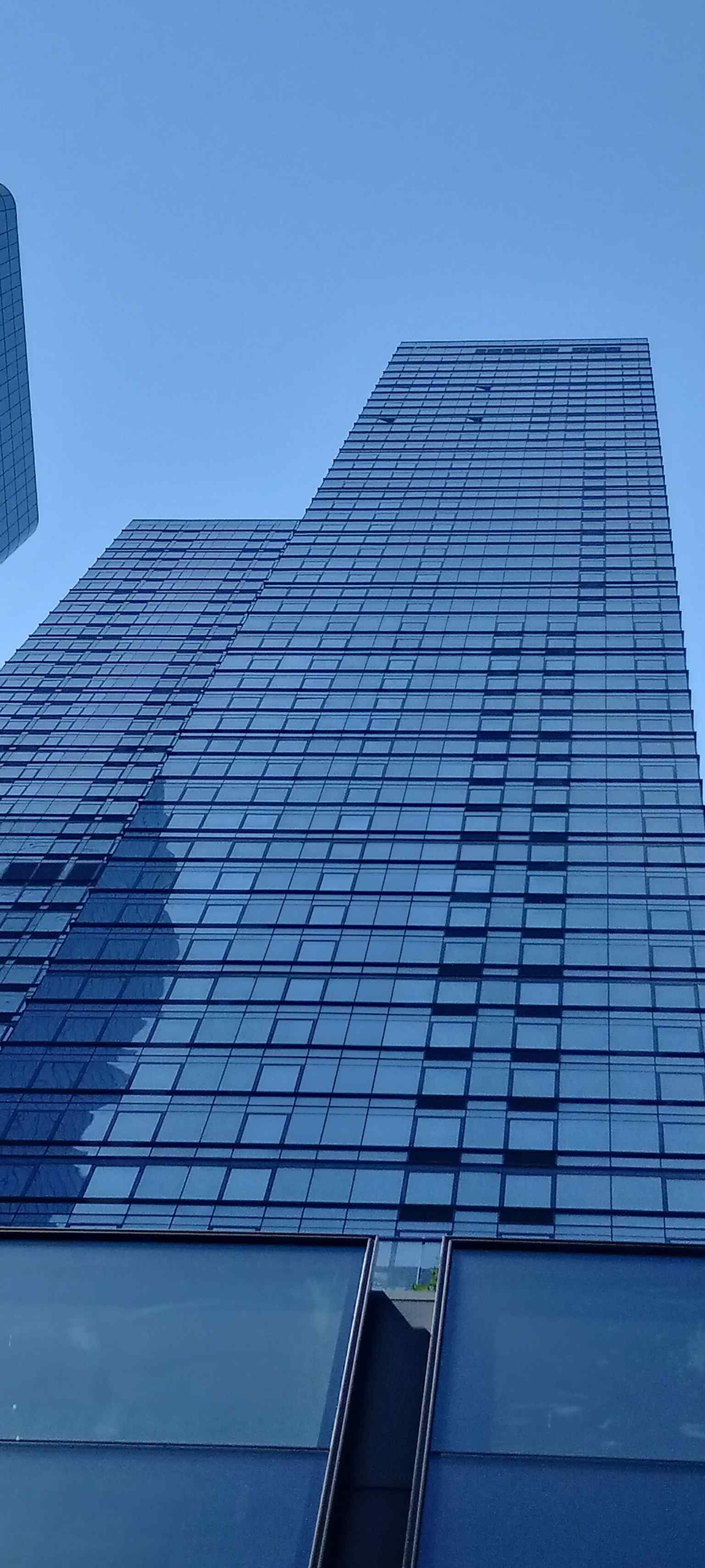 A crisp street-level view of The Eugene’s neighboring Manhattan West towers, showing the modern West Side development it belongs to.