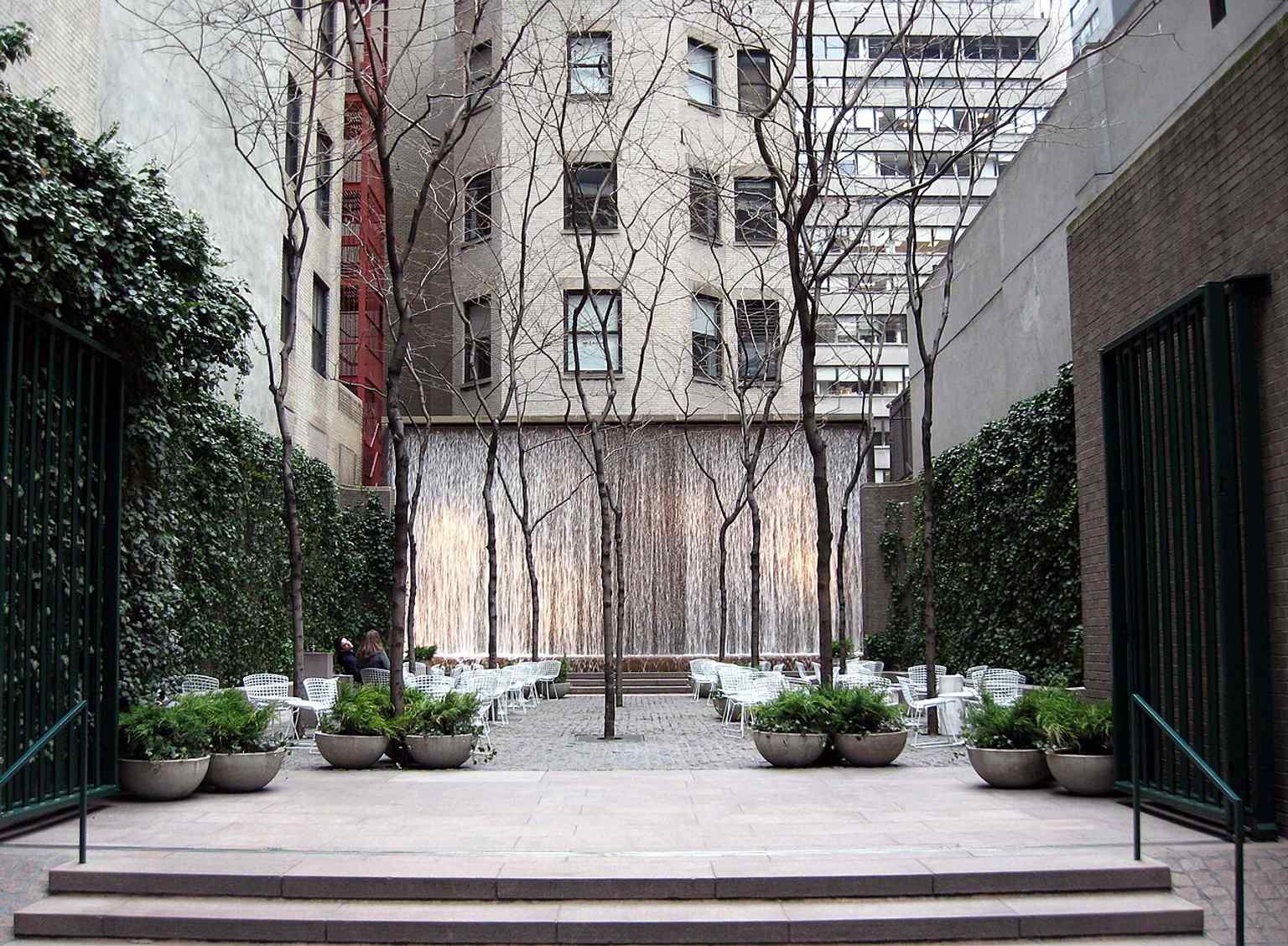 A winter view of the pocket park’s tiny footprint, tucked between Midtown towers as a quiet urban retreat.