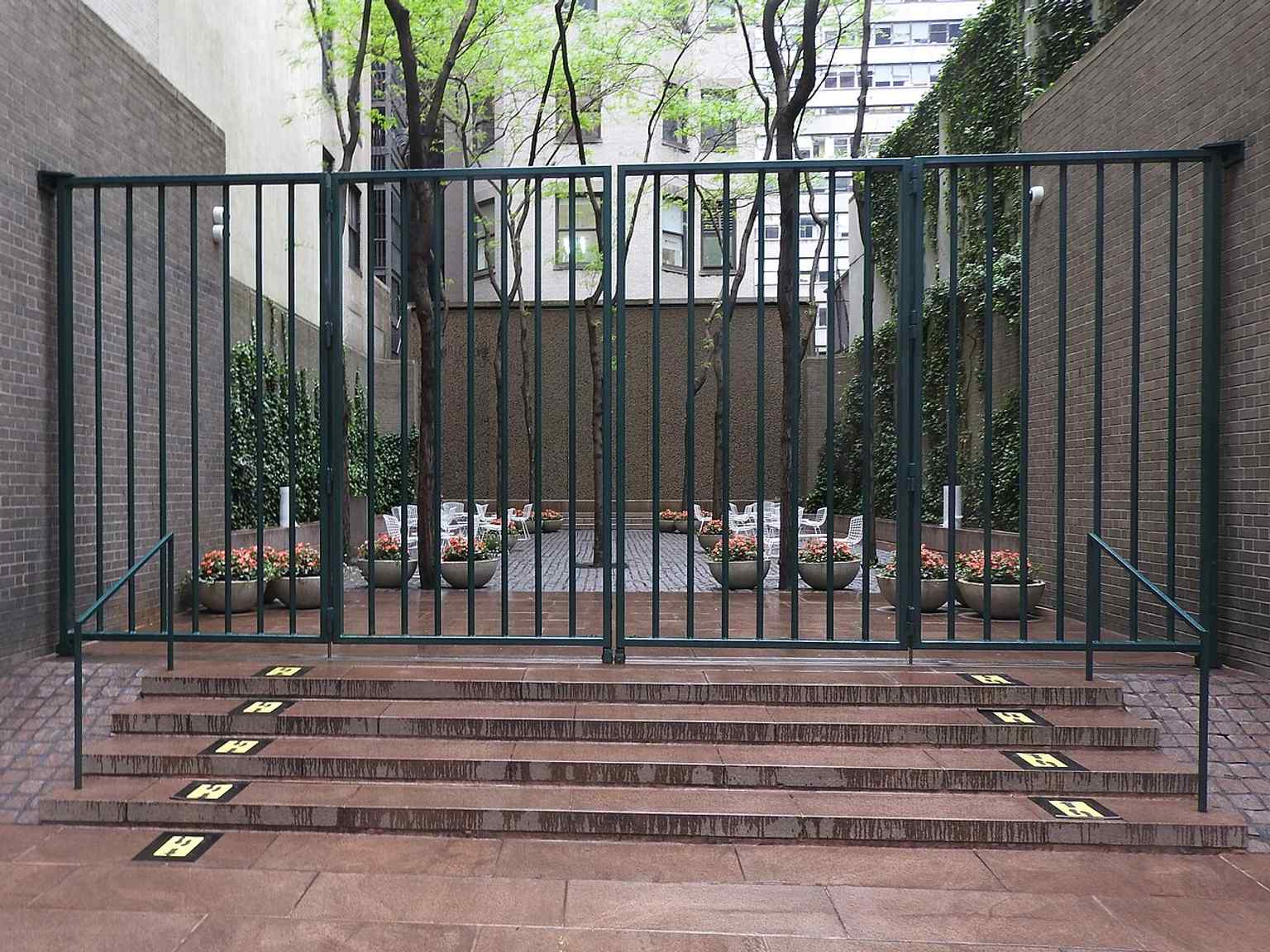 The park closed in 2021, with its street-facing entrance showing how this small plaza opens directly to 53rd Street.