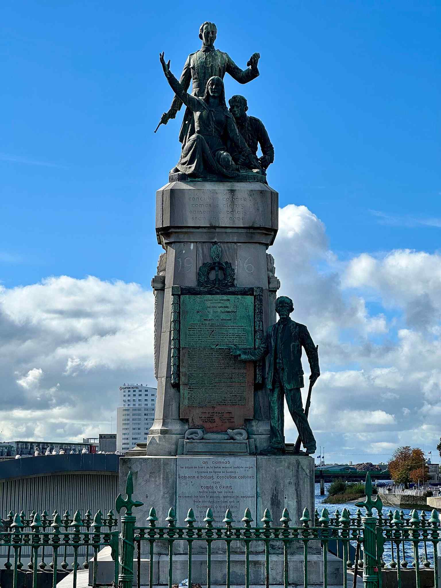 Observe the memorial's bronze statues at the top, representing local Easter Rising participants Tom Clarke, Ned Daly, Con Colbert, alongside a figure of Mother Ireland.