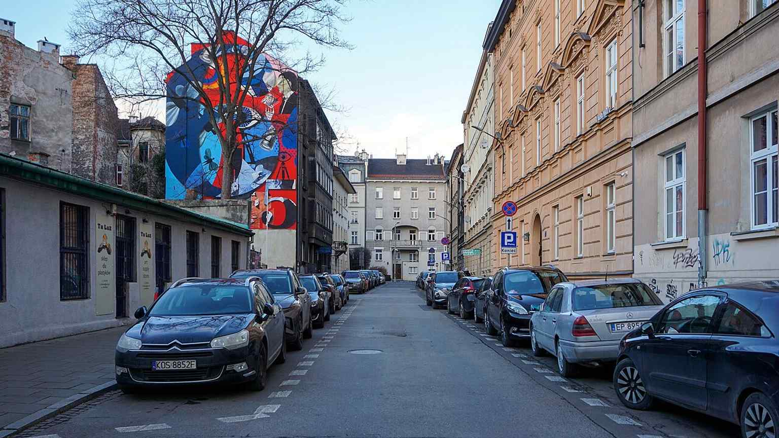 A northward view along Adam Asnyk Street, showing the small historic street that links the Basztowa area with Biskupia Street.