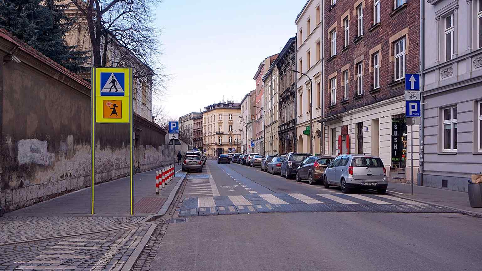 Northward view along Łobzowska Street in Kraków, showing the street’s current urban character on the route that once followed an old path beside the Rudawa and Młynówka Królewska.