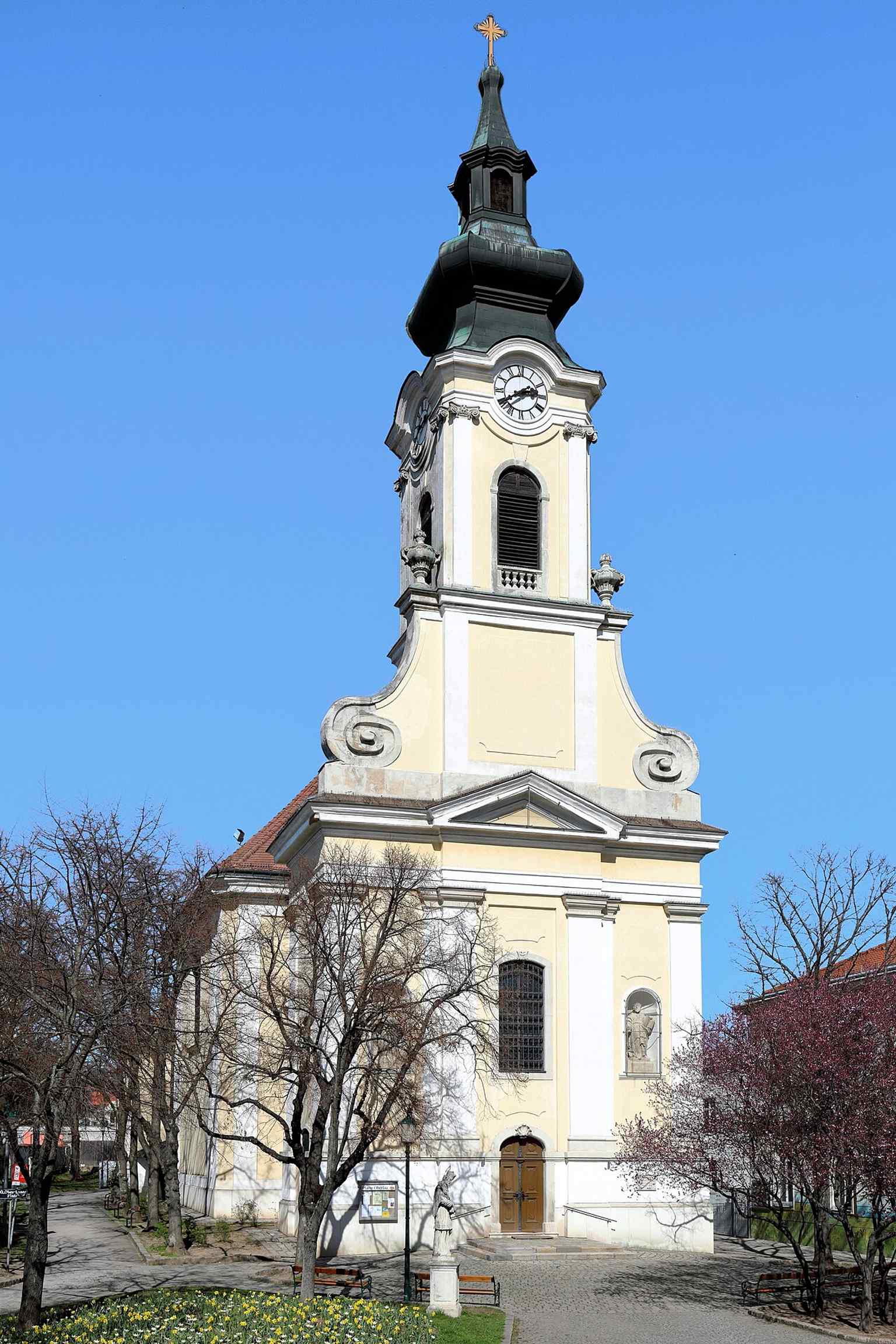 This southwest view showcases the Baroque style of the Oberlaa Parish Church, rebuilt by Mathias Gerl between 1744 and 1746 after its destruction during the 1683 Turkish siege.