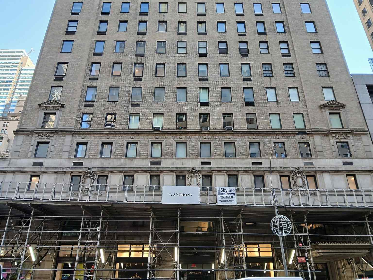 The Ritz Tower rising above Midtown in 2025, its tall brick shaft and setback crown still recognizable from afar.