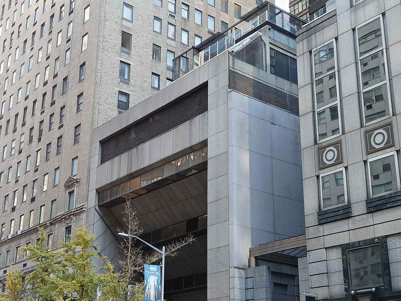 A wider streetscape view including the Ritz Tower and neighboring buildings, useful for placing the landmark in its Park Avenue setting.