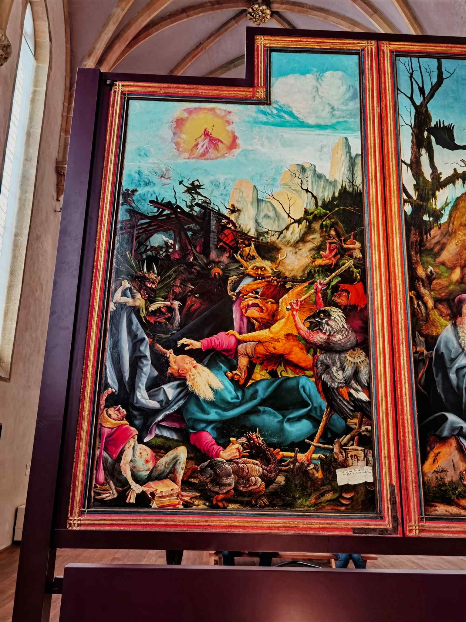 A vivid and terrifying panel showing Saint Anthony attacked by bizarre demons, whose diseased limbs mirror the exact symptoms of ergotism (2023).