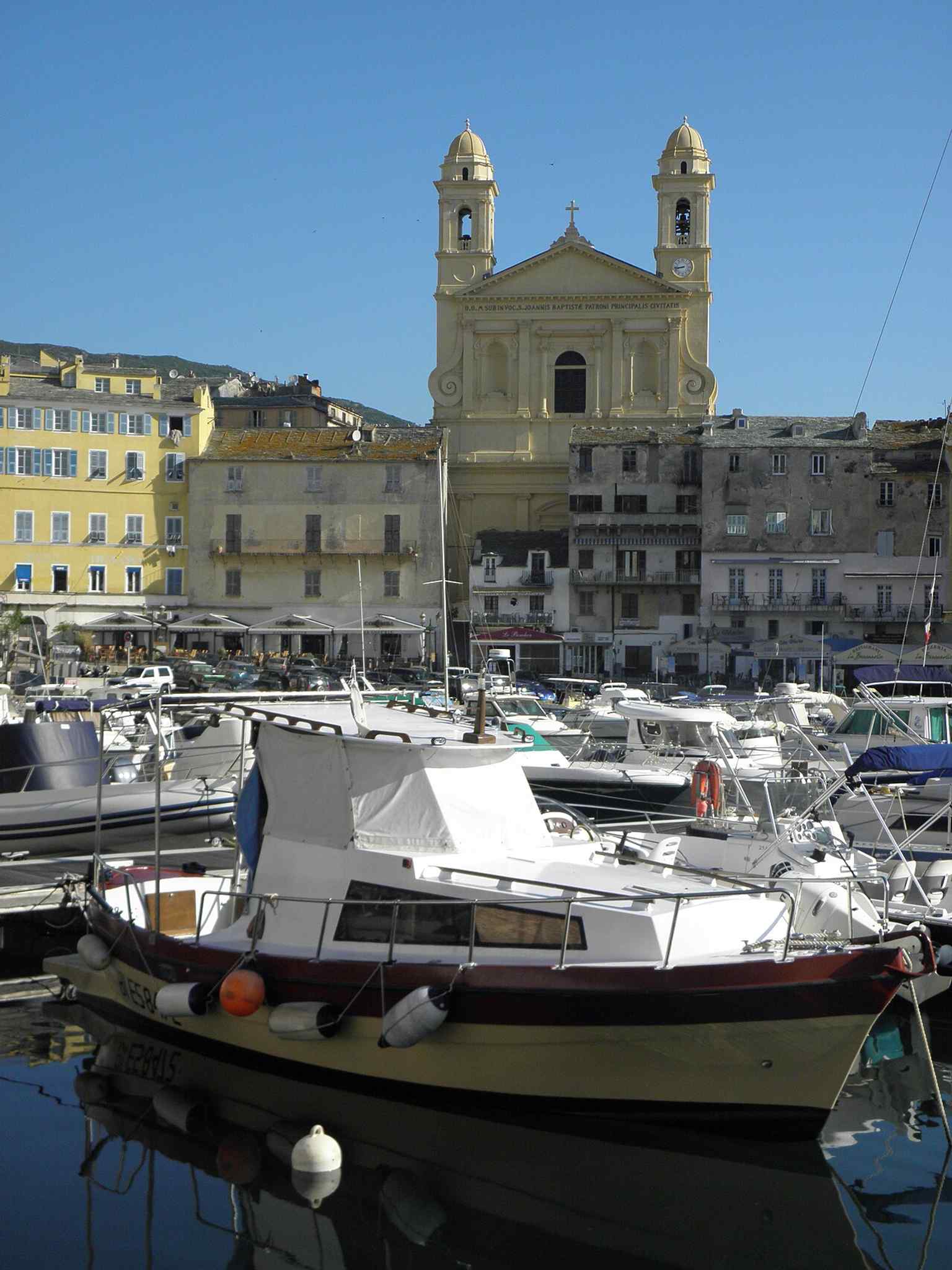 The church rising over Bastia’s old port, echoing the 19th-century view of Saint-Jean-Baptiste with its single earlier bell tower.