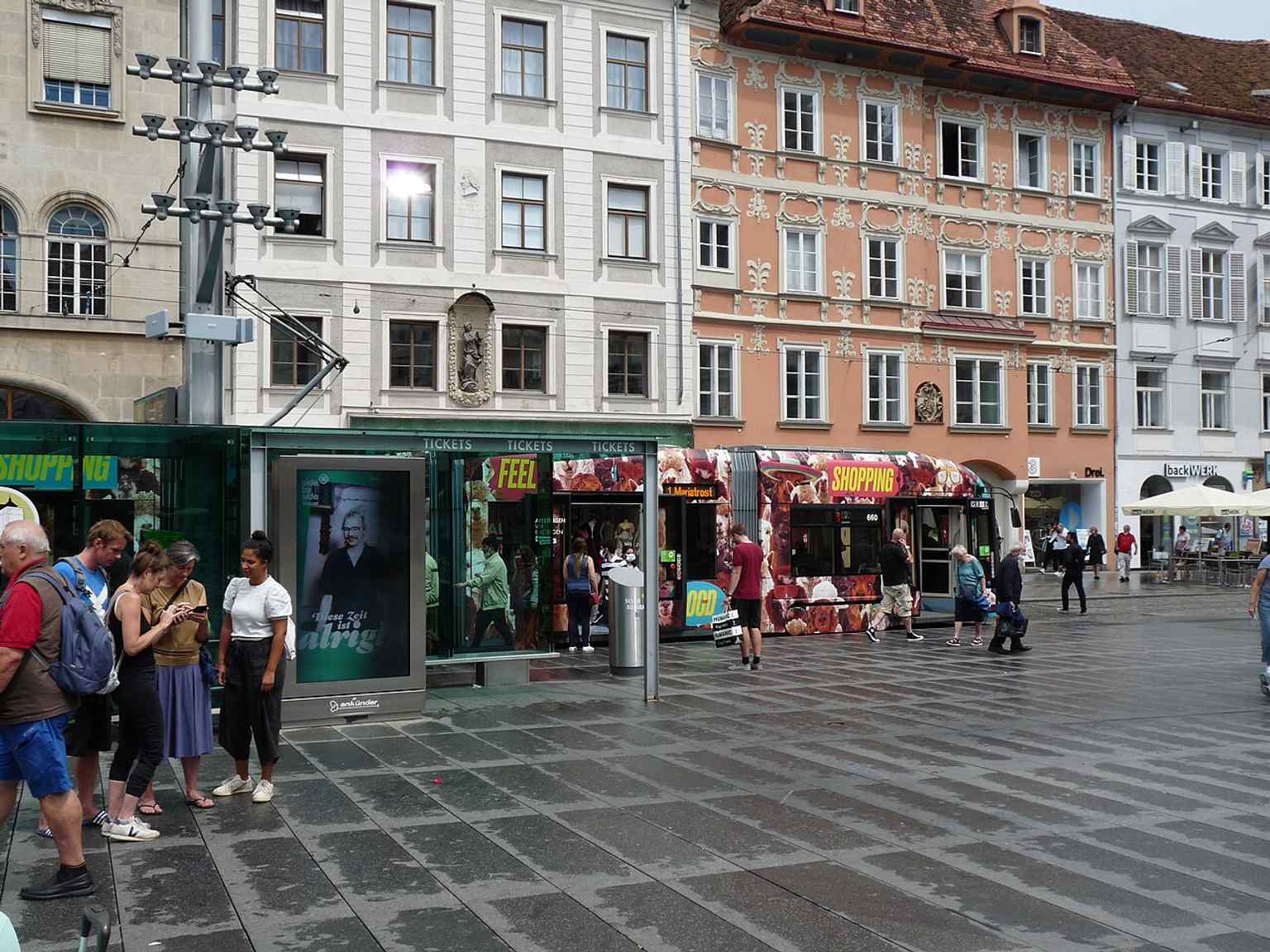 Modern trams passing through Graz Main Square show how this medieval market place remains a busy urban crossroads.