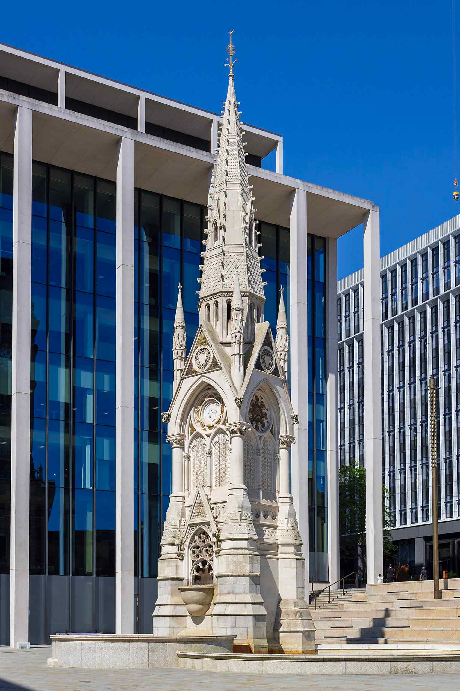 A modern close view of the 65-foot neo-Gothic memorial, useful for seeing the Portland stone spire and fountain bowls restored in 2021.