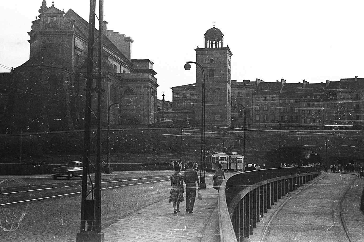A broad city view from the bridge area places St. Anne’s Church in Warsaw’s skyline, close to the Royal Castle and Old Town.