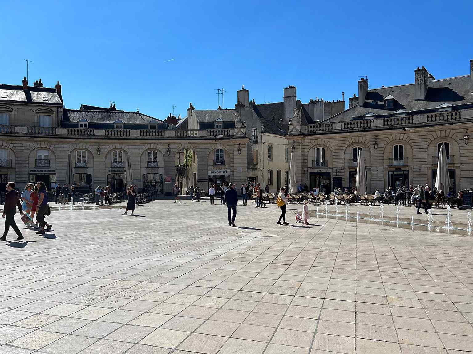 The modern Place de la Libération, transformed into a pedestrian area in 2005-2006 with Comblanchien stone paving and new fountains.