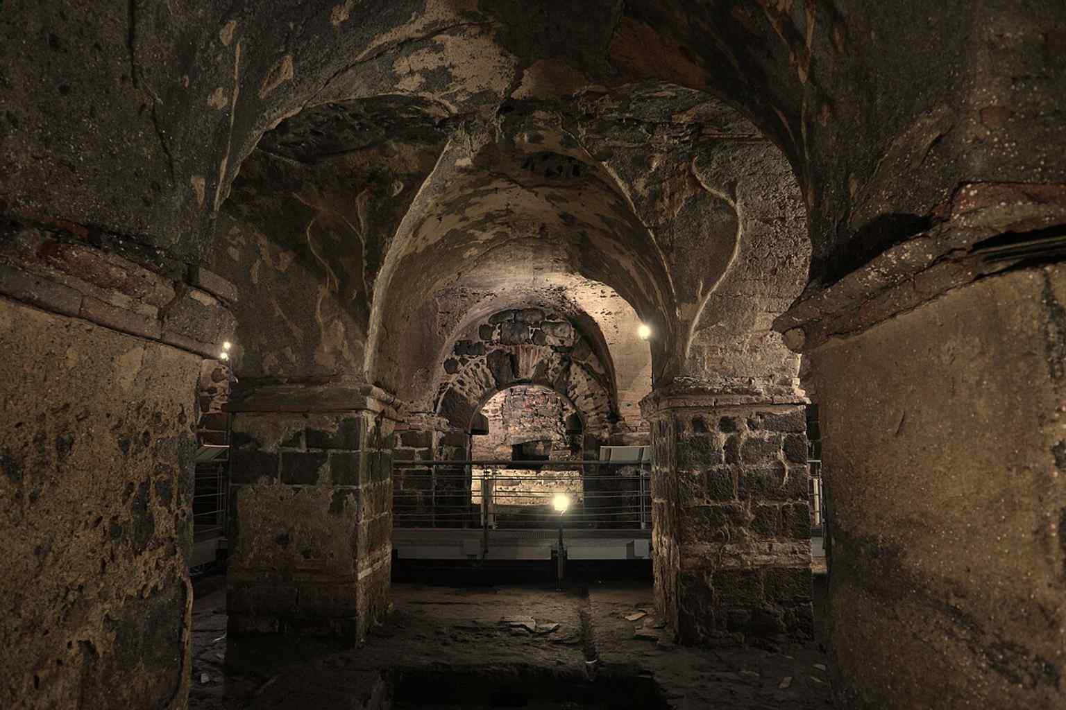 A view inside the Achillian Baths, where the underground Roman complex survives beneath Piazza del Duomo and was once threatened by flooding from the Amenano.