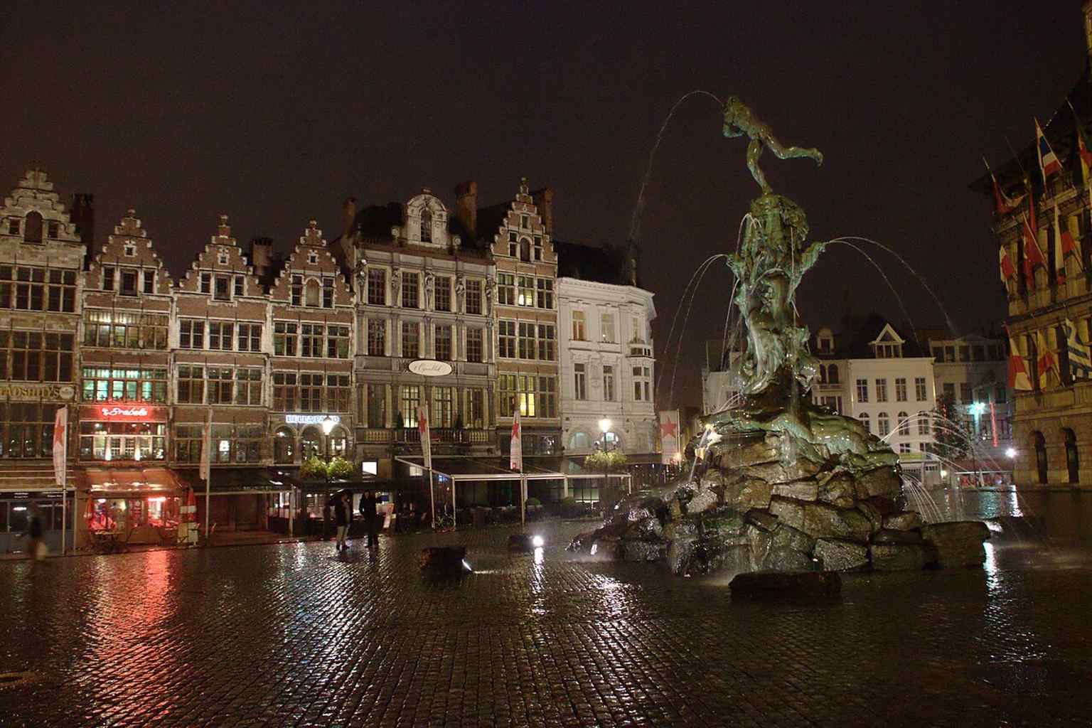 The fountain at night in Antwerp’s main square, showing how the monument anchors the Grote Markt after dark.
