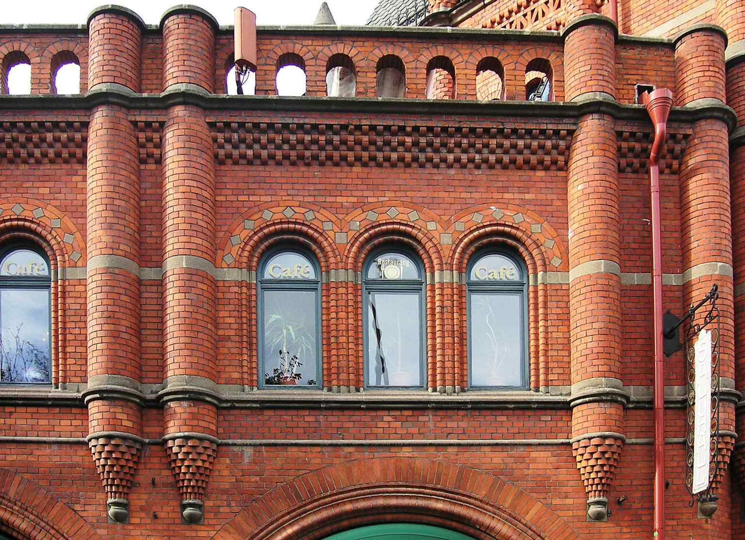 A wider view of the historic saluhall, famous for its ornate late-19th-century architecture and landmark corner site.