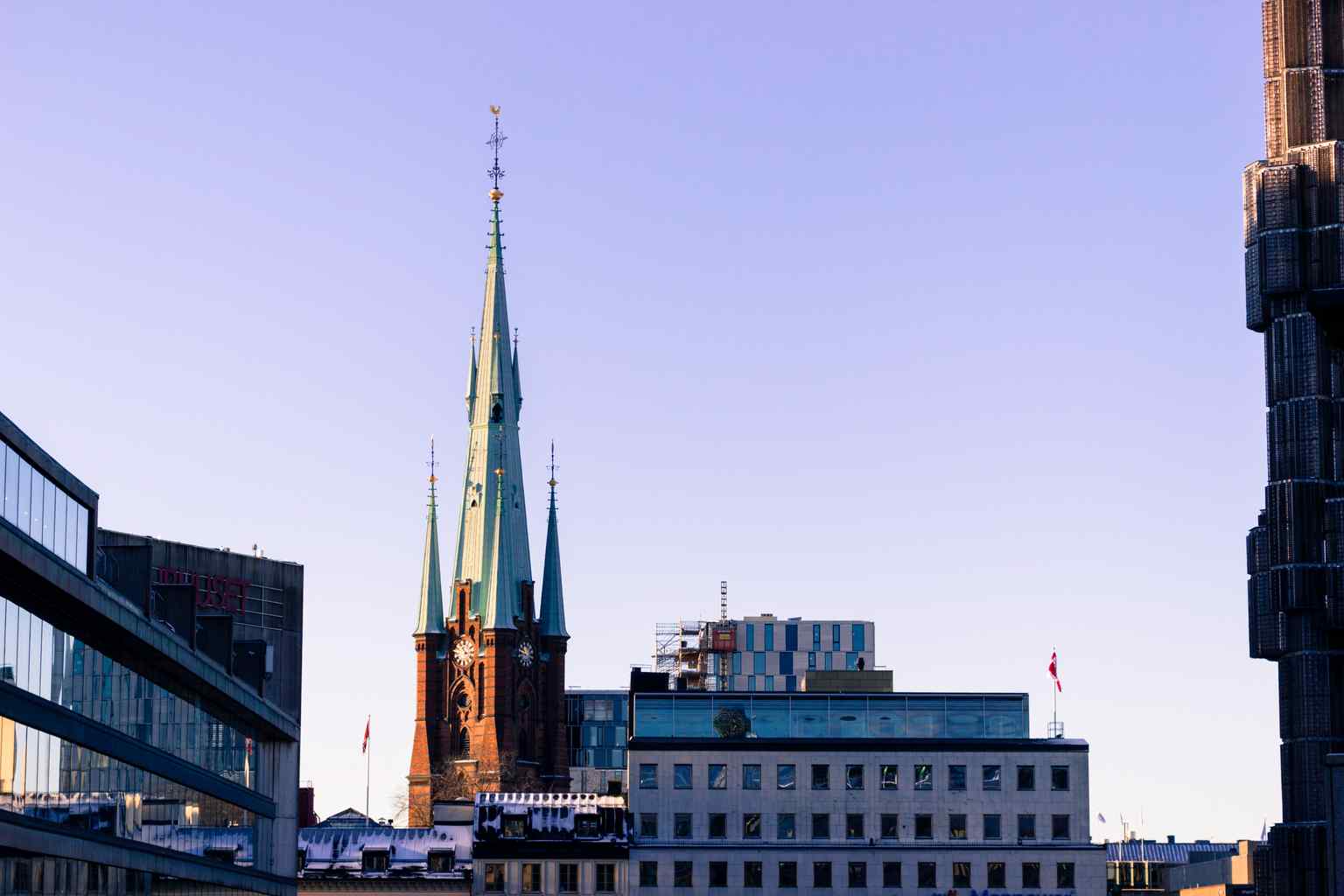 The church's 116-meter high tower, reconstructed after the devastating 1751 fire, features a distinctive copper-clad spire.