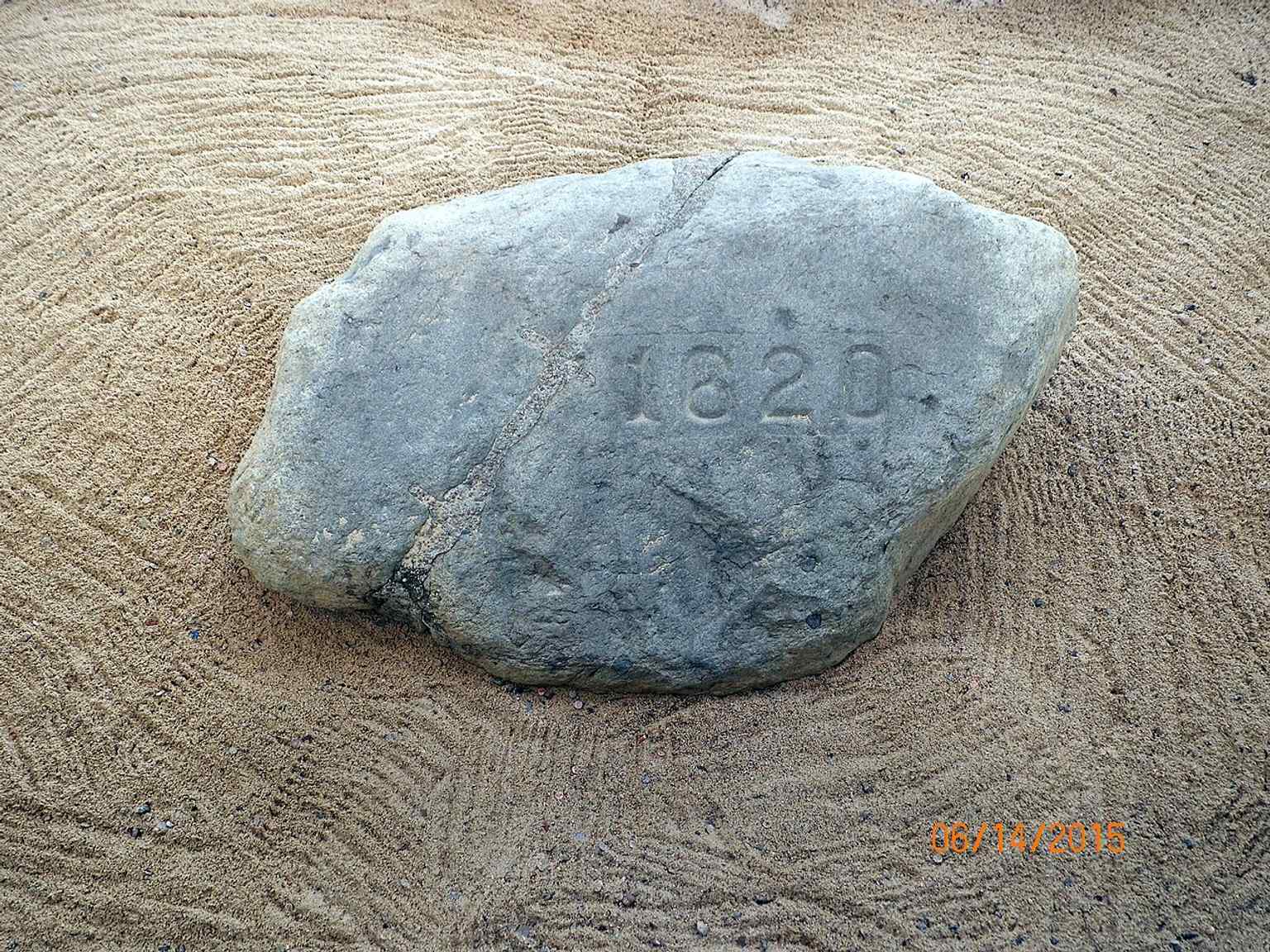 The iconic date "1620" was carved into Plymouth Rock when it was rejoined and returned to the shoreline in 1880, after being split in 1774.