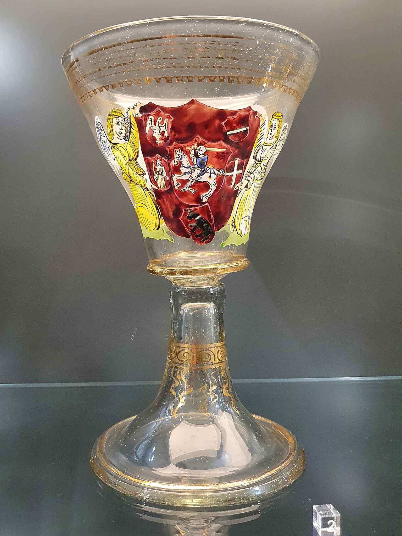 A copy of Alexander Jagiellon’s goblet bearing the Lithuanian Vytis, linking the palace to its late-15th-century royal residents.