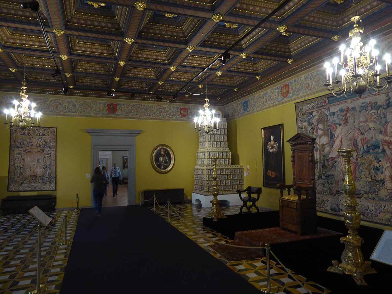 A formal state room with a throne-like setting, echoing the palace’s role as the political center of the Grand Duchy of Lithuania.