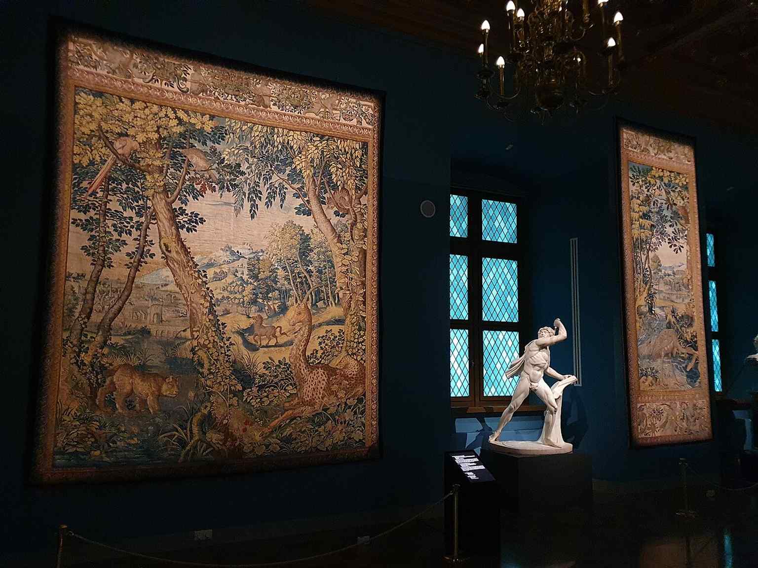 The Blue Room filled with Jagiellonian tapestries, recalling Sigismund II Augustus’s legendary collection of textiles.