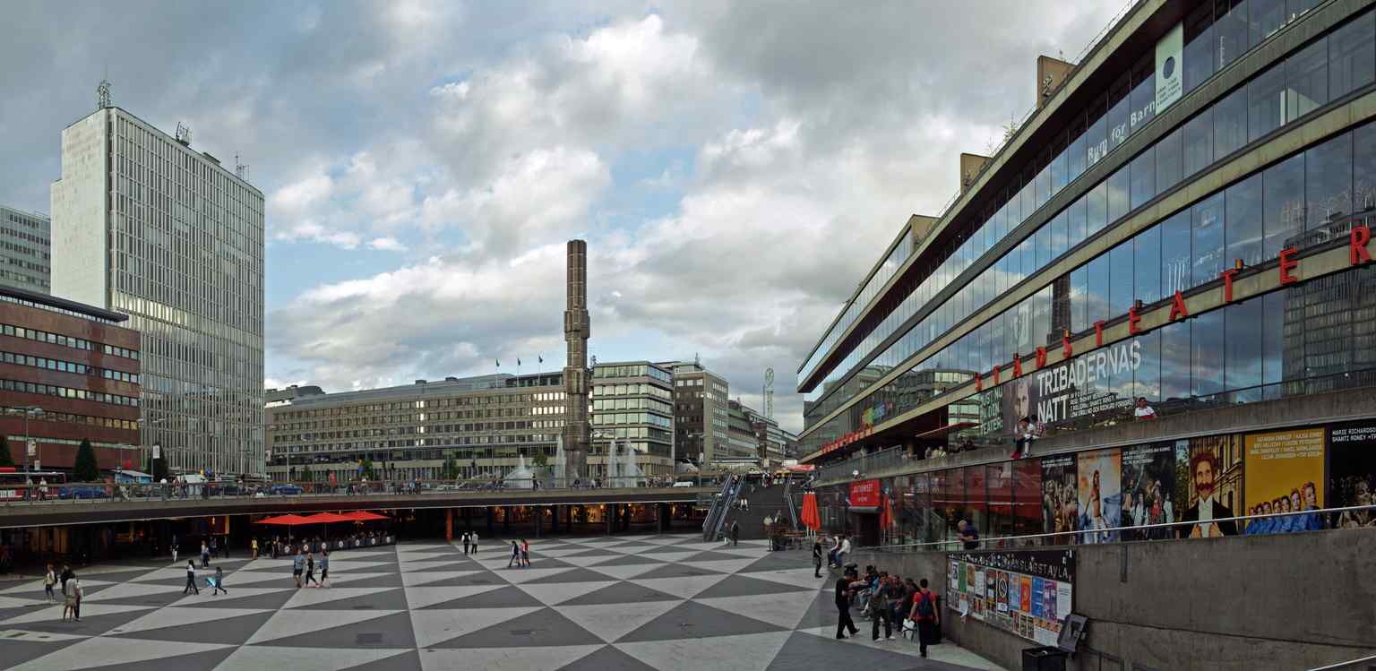 An iconic view of Sergels torg, known as 'Plattan,' showcasing its distinctive black and white triangular pattern designed by Jörgen Kjaersgaard.