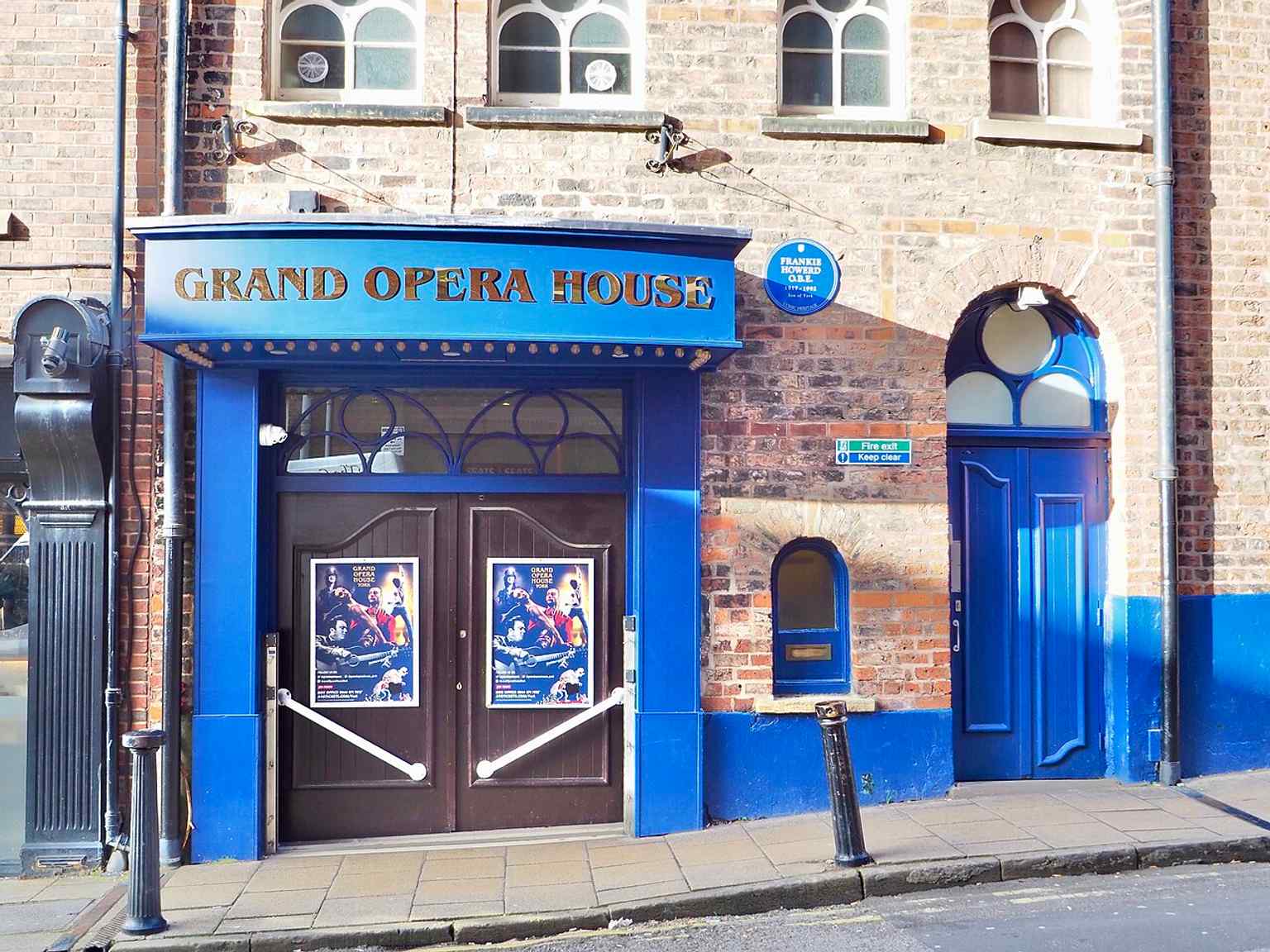 The Cumberland Street entrance, with the Frankie Howerd plaque, shows how audiences still enter through the building’s side arch rather than a grand theatre frontage.