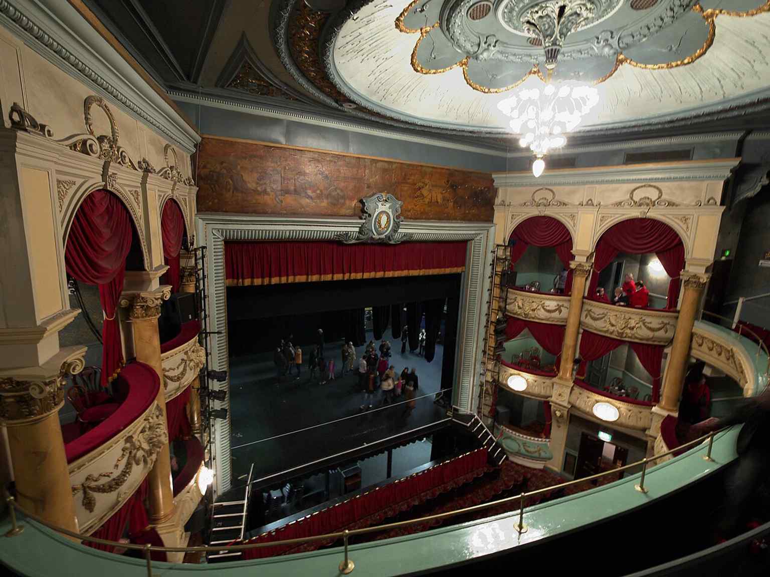 The Cumberland Street entrance of the Grand Opera House, featuring a memorial plaque for Frankie Howerd, photographed in 2022.