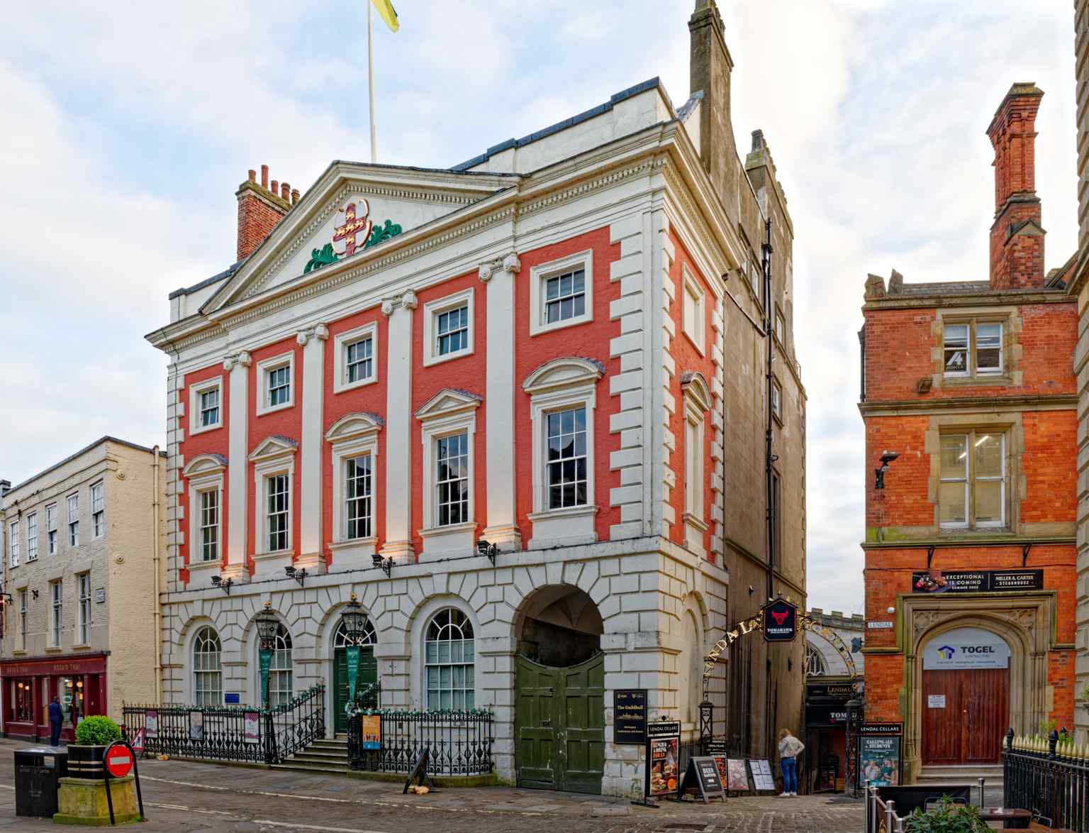 A close-up view of the building along Coney Street, where major restorations revived the intricate stonework and bright crest. (2024)