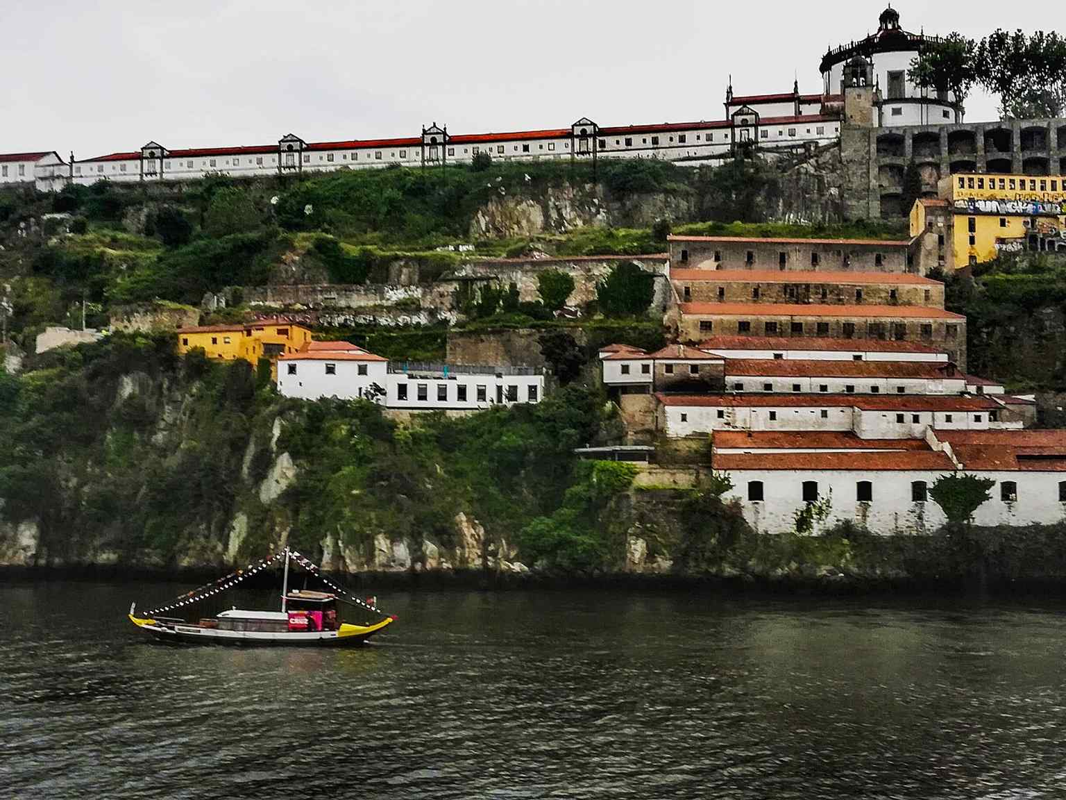 A classic riverfront view of Serra do Pilar and the Douro, highlighting the monastery’s dramatic hilltop setting.