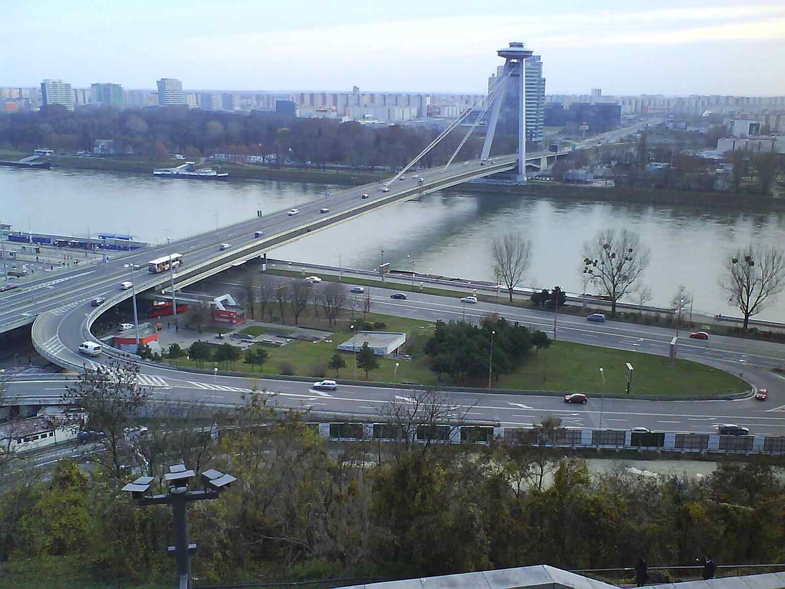 SNP Bridge seen from Bratislava Castle in 2009, showing how the landmark cuts across the Danube and reshaped the city’s historic riverfront.