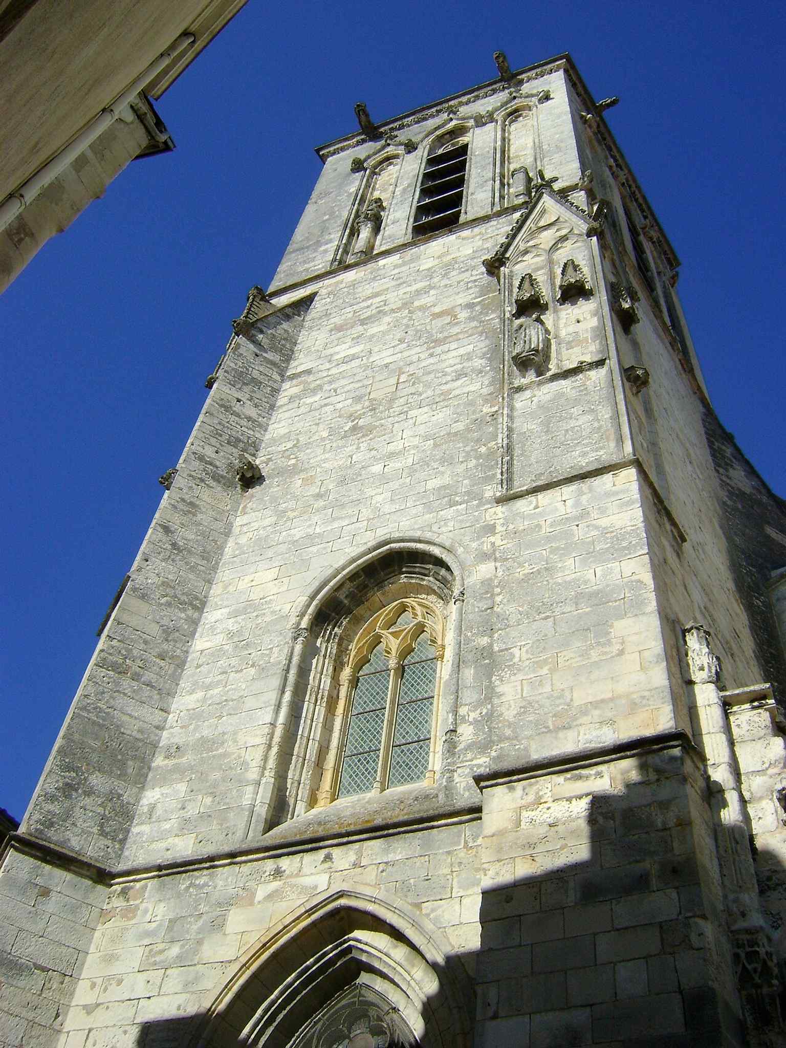 The bell tower, the main medieval survivor of the earlier churches, preserved even after the destruction and wartime use of the site.