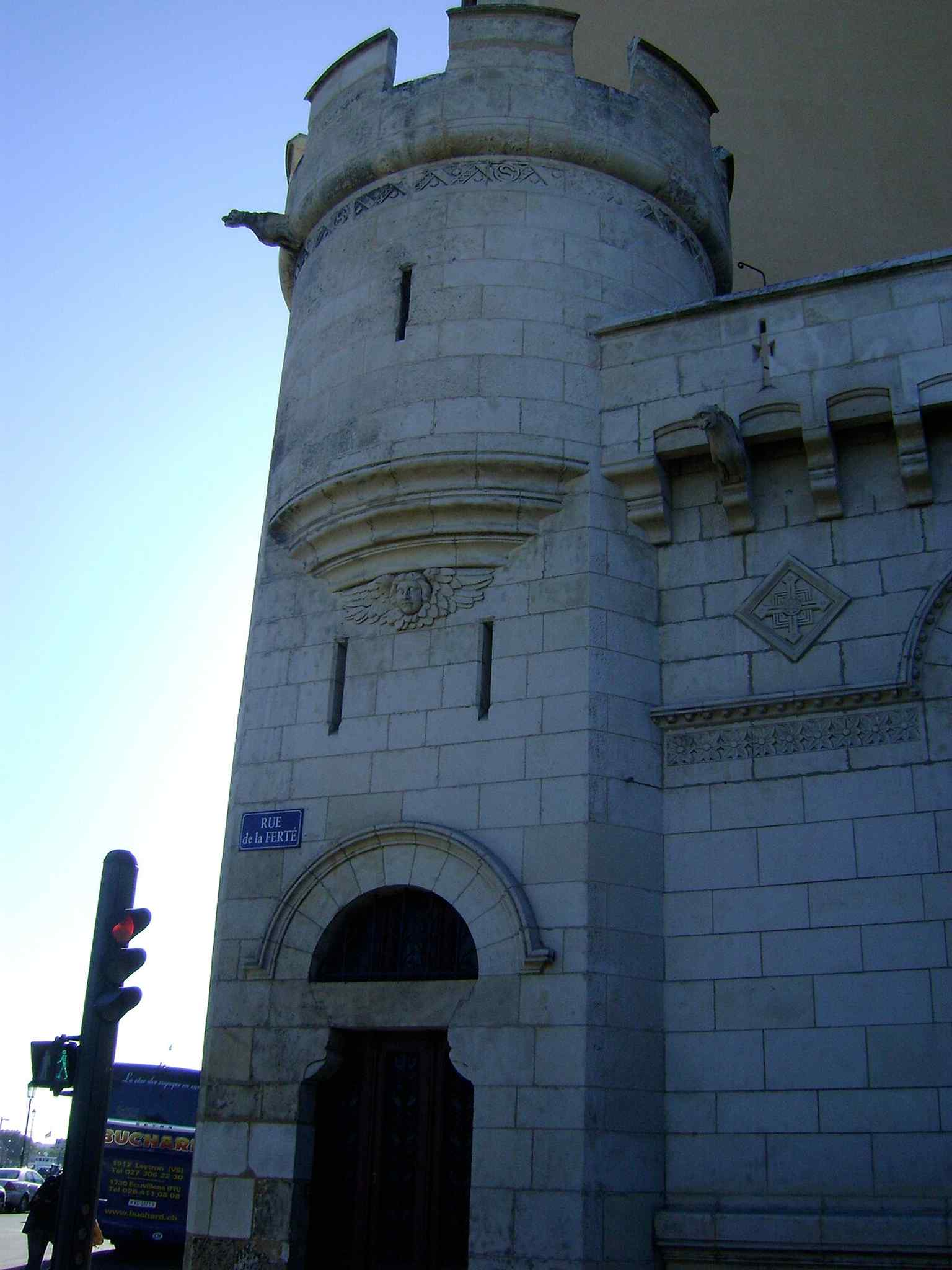 The small exterior turret recalls the layered rebuilding of Saint-Sauveur, where later additions had to fit around older masonry.