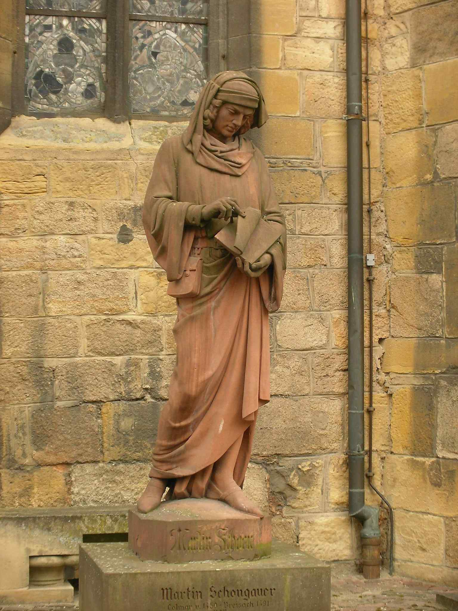 The lonely sandstone figure resting on its modern base in Colmar, seen in 2012 before its final relocation back to its original spot.