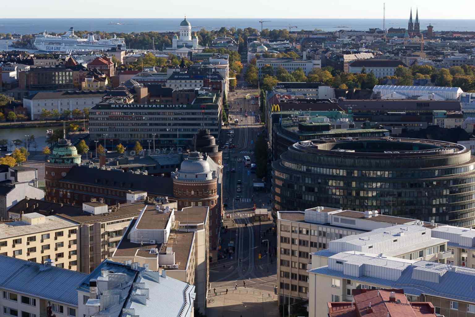 An elevated view of Siltasaarenkatu beside Arena House — this street forms one edge of the block, where tram traffic once surrounded the building.