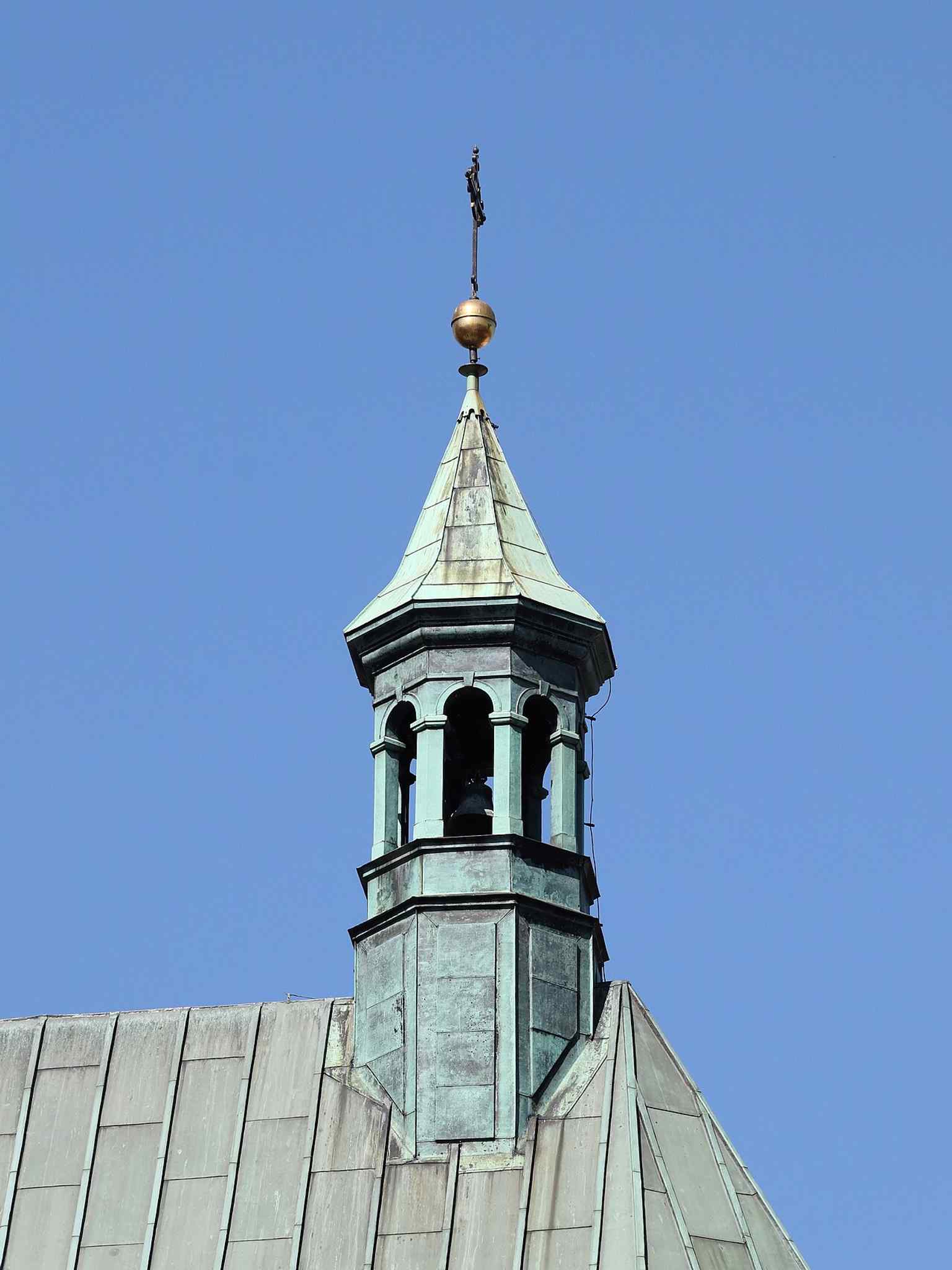 The tower above the presbytery, showing the church’s Gothic revival silhouette and the rebuilt postwar form seen today.
