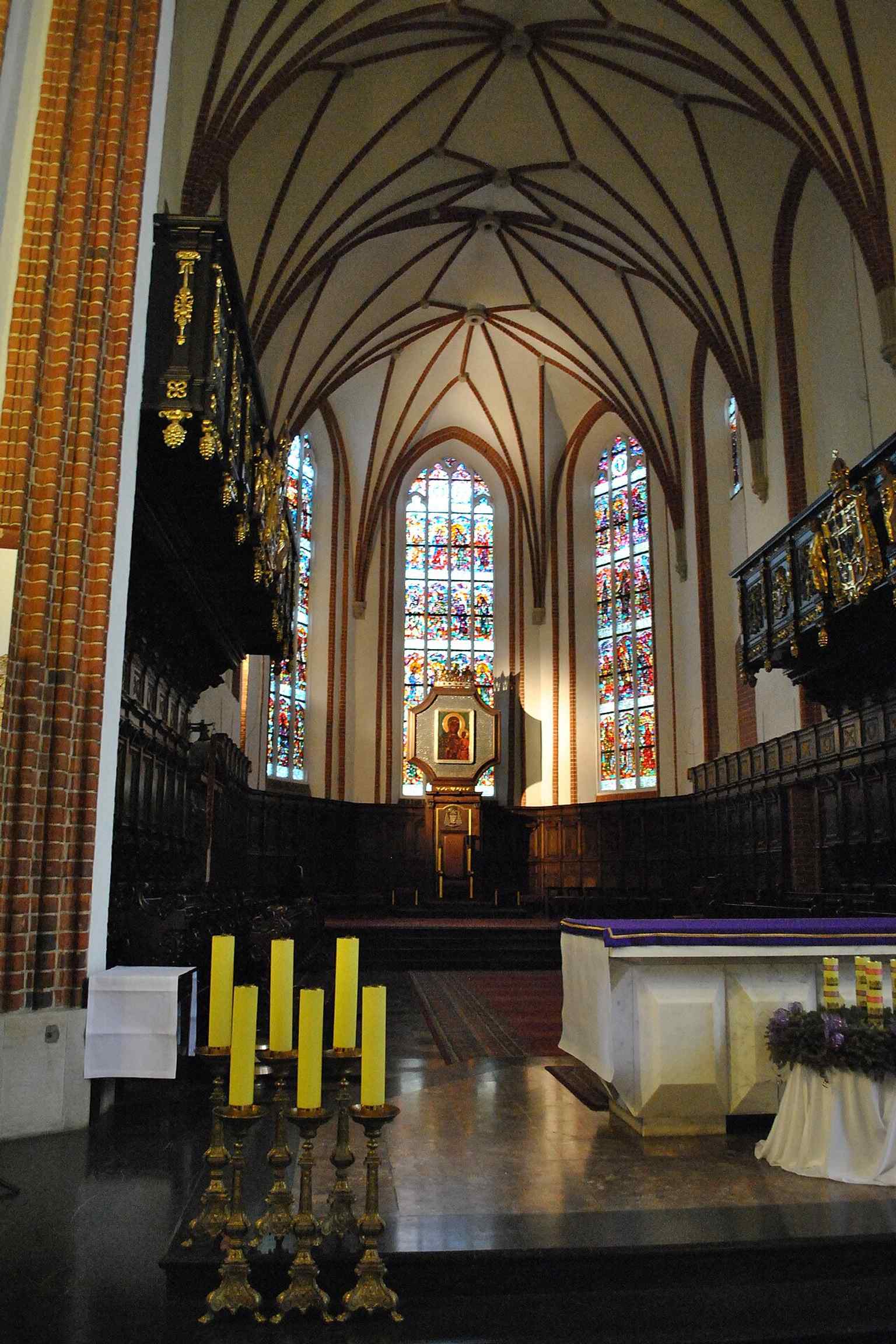 The presbytery, where the main altar and choir stalls anchor the cathedral’s liturgical heart and its postwar reconstruction.