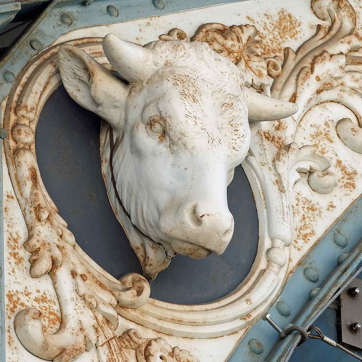 Spot the ox head motif adorning the arches, a symbolic nod to the agricultural goods and livestock historically traded within these magnificent market halls.