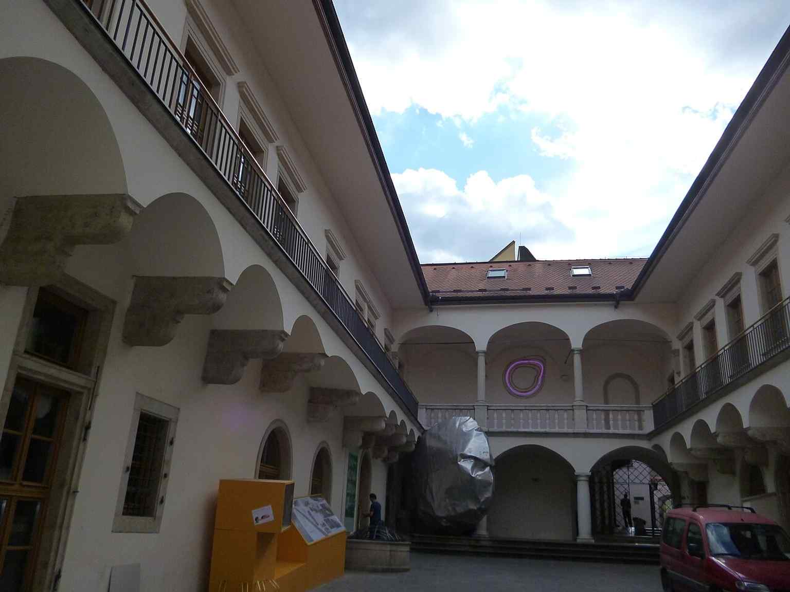 The courtyard of the palace, where the complex history of medieval houses later merged into the Renaissance residence can still be sensed.