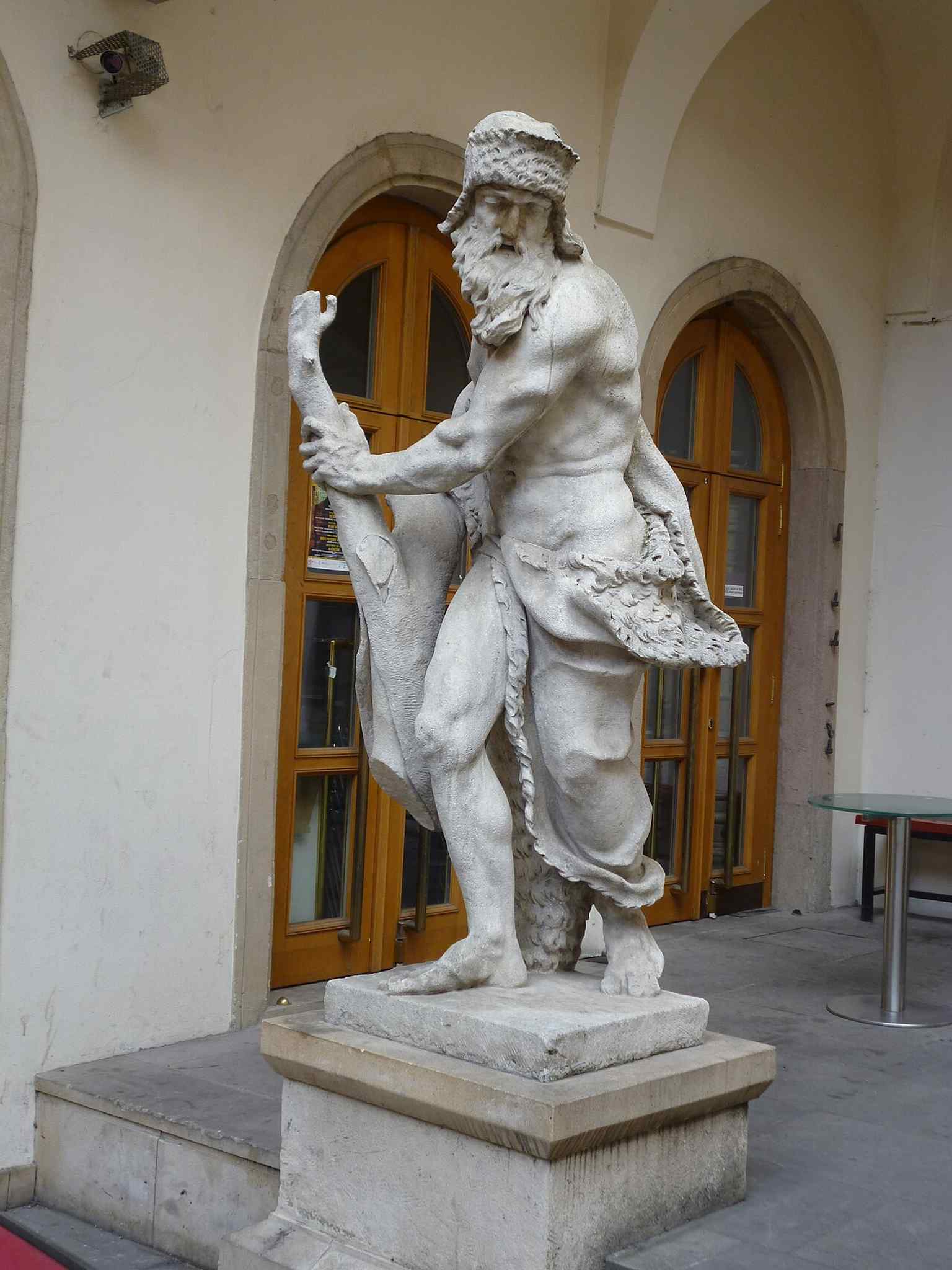A courtyard sculpture detail inside the palace complex, adding a glimpse of the art and exhibition atmosphere that the building has served in modern times.