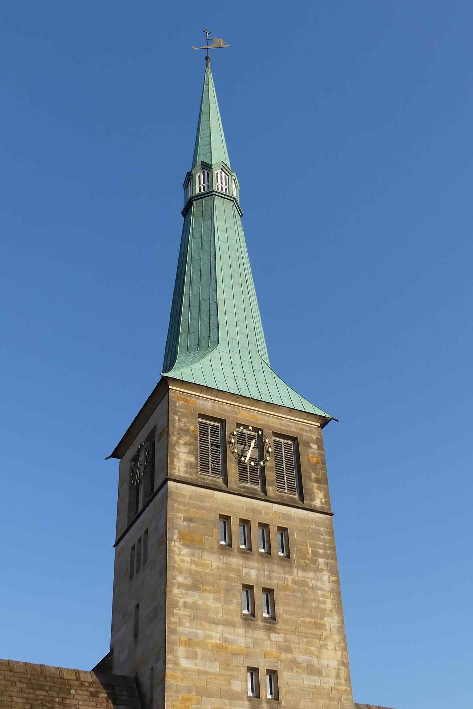 The church tower rising over Hamelin, a rebuilt feature whose exact height is still given differently in the sources.