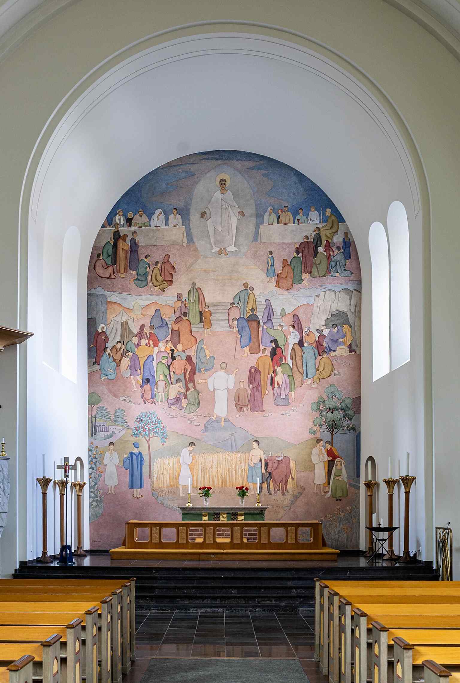 The chancel interior with Sigurd Möller’s fresco-secco, “The Great Banquet,” one of the church’s most distinctive post-restoration artworks.