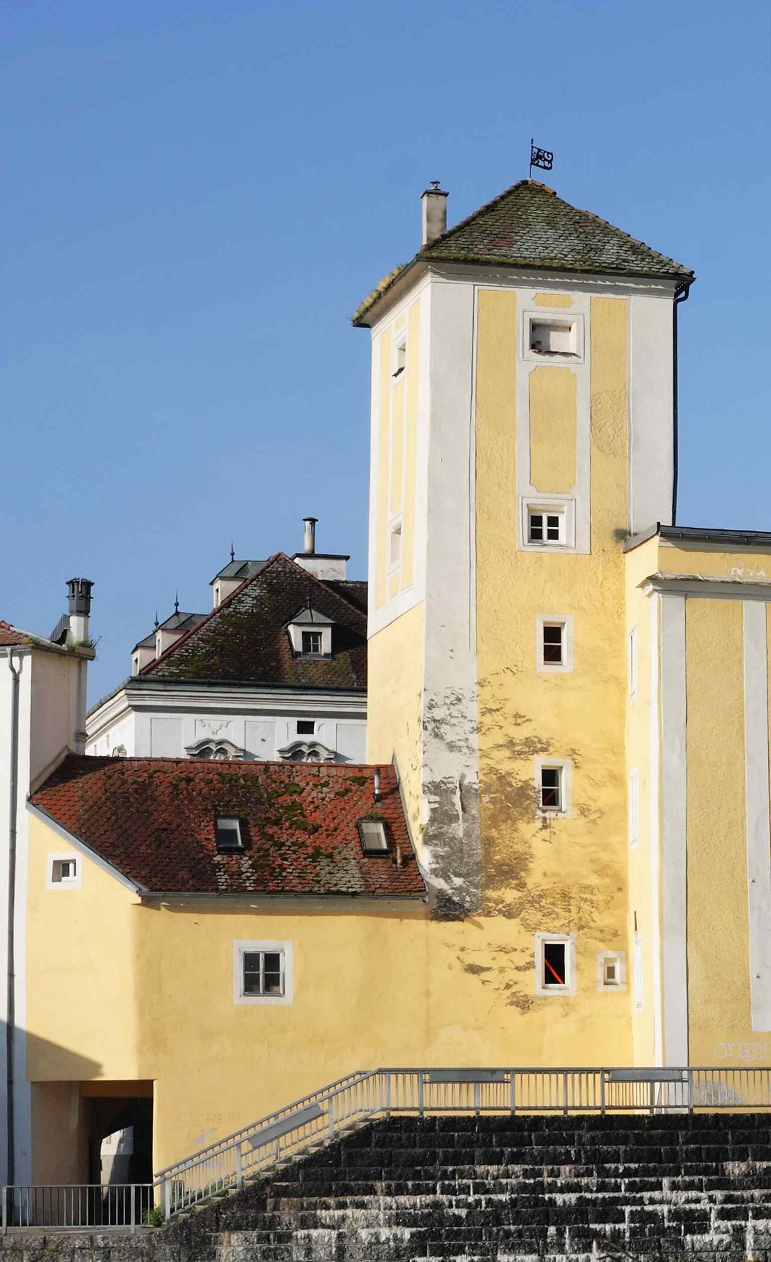North façade of the Water Tower seen from Ortskai, showing the historic tower in its riverside setting near the Steyr.