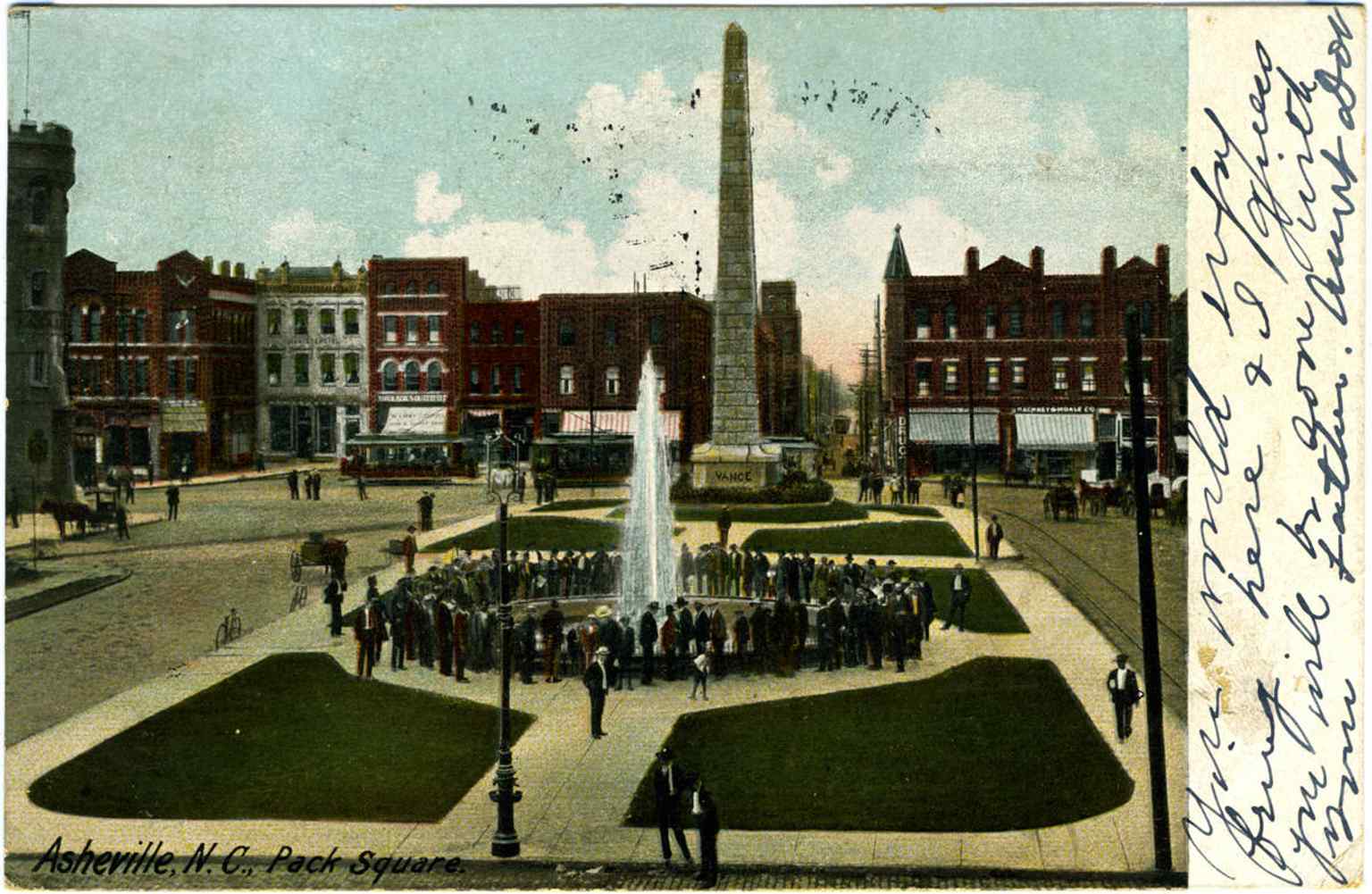 A 1906 postcard showing the monument’s pedestal marked “Vance,” when it was still framed by the busy square and streetcar era Asheville.