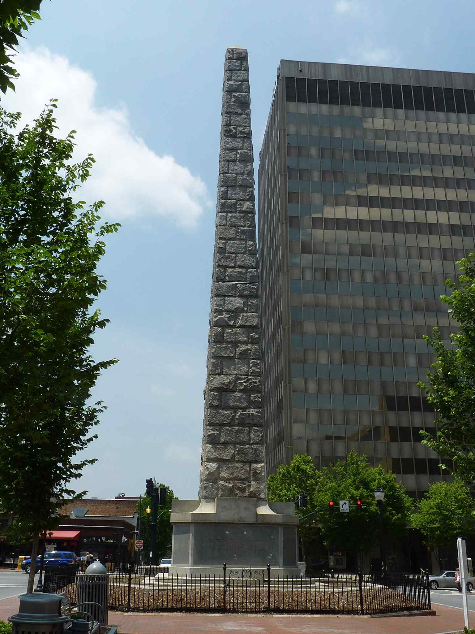 The monument seen from Patton Avenue, emphasizing how the tall obelisk dominated the Asheville streetscape.