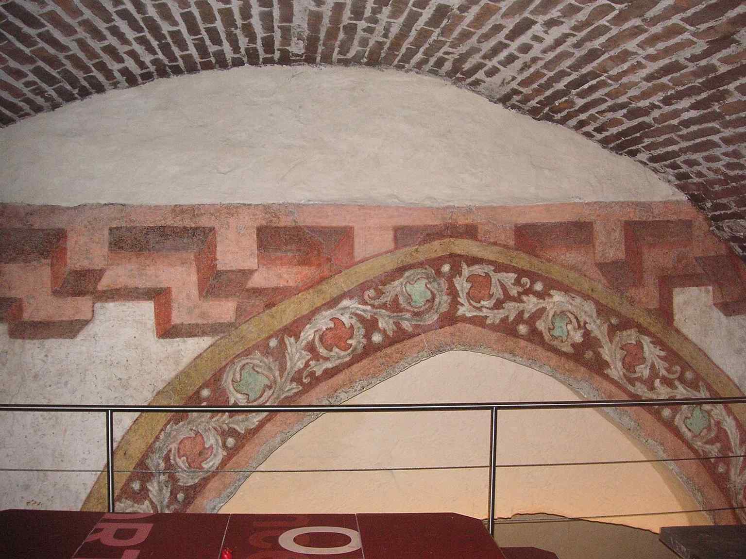 Frescoes in the cellar reveal hidden historic layers beneath the monastery, beyond the public church and library spaces.