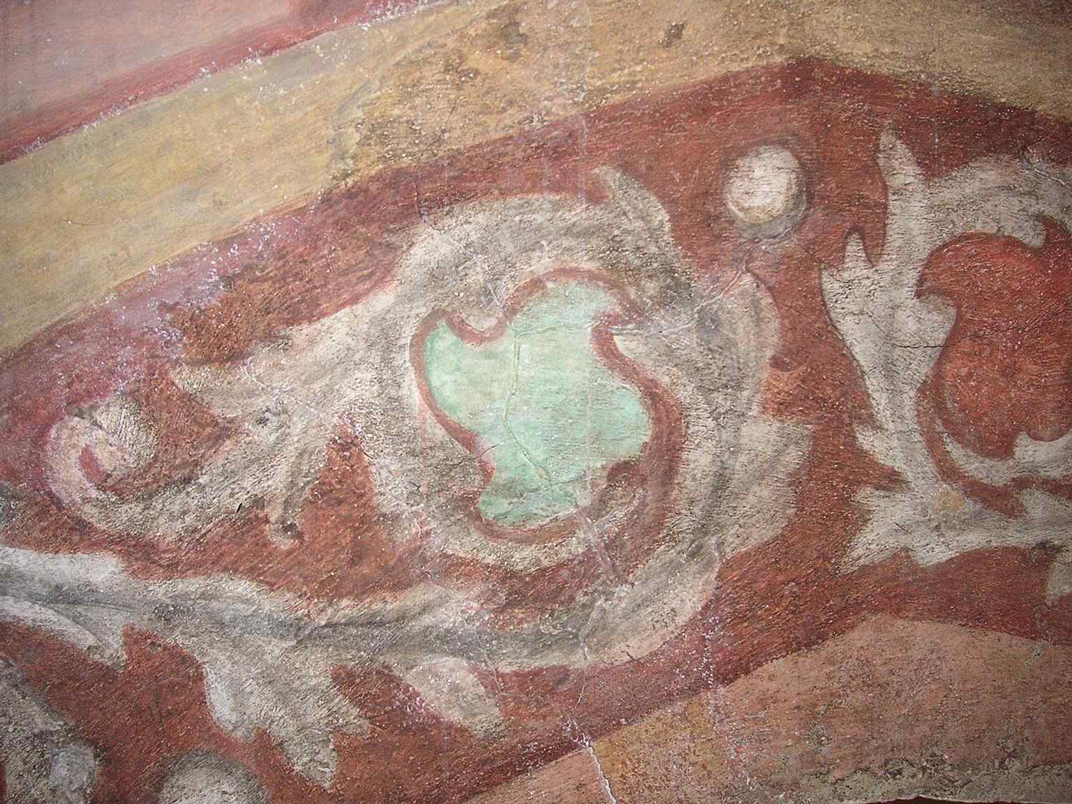 A close-up of cellar frescoes highlights the preserved decorative details tucked away inside the Franciscan complex.